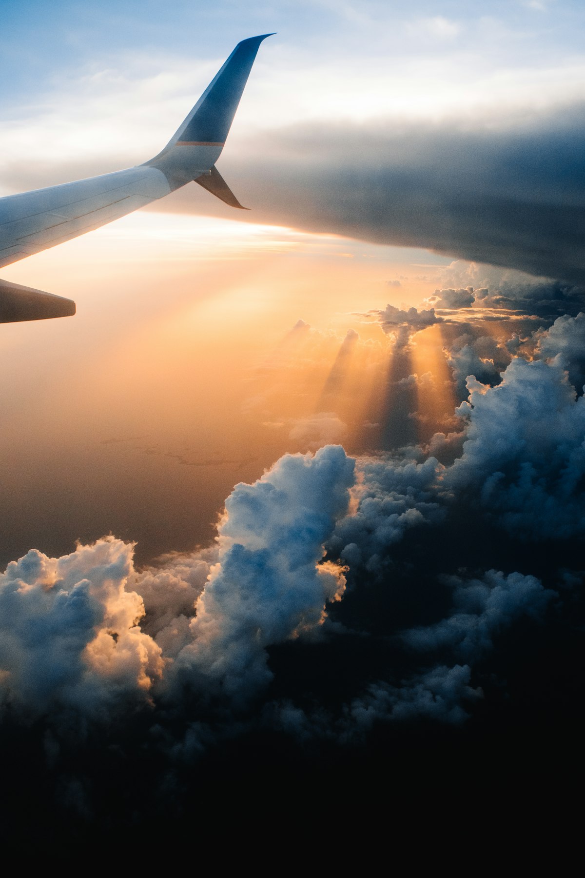 View over an airplane wing at golden hour